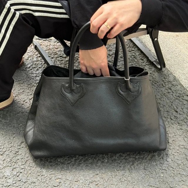 Black leather tote bag on the catalogue